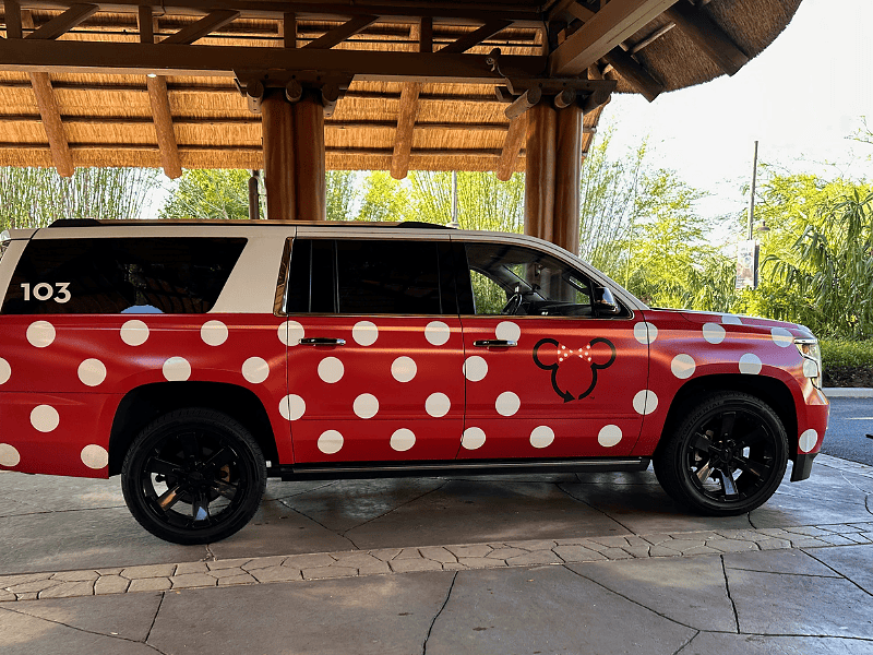 Disney Minnie Van transportation service suburban with red and white polka dots