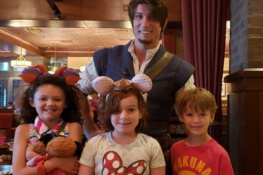Flynn Rider and kids at Bon Voyage Breakfast at the Boardwalk Walt Disney World