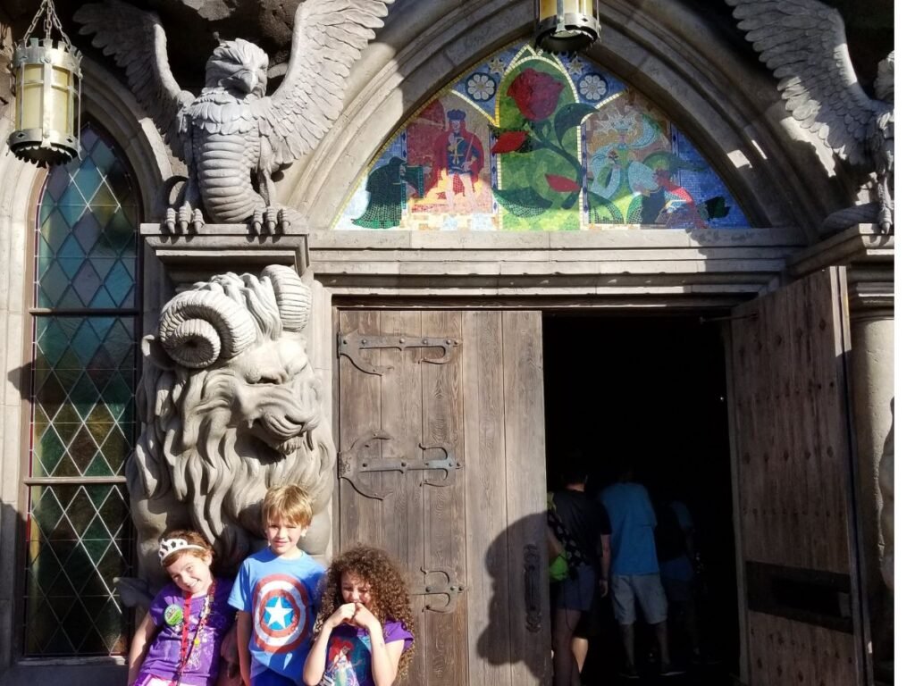 Kids at Entrance to Be our Guest Restaurant vegan food at magic kindom